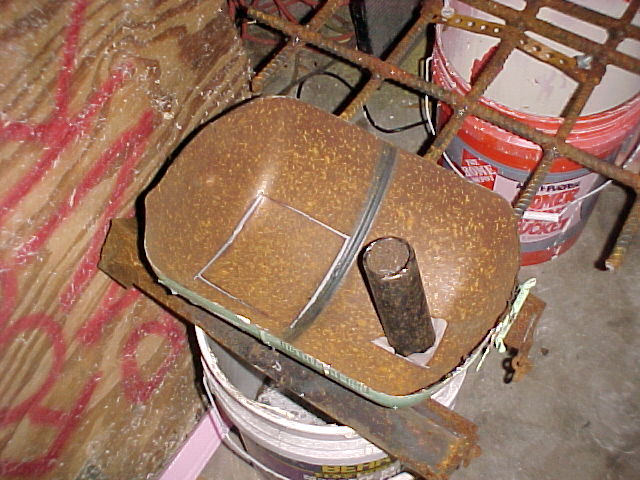 the cutouts from the top are taped in place to keep the refraCTORY FROM LEAKING.JPG